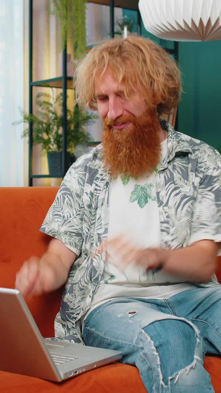 Amazed young man use laptop computer receive good news message shocked by victory celebrate win