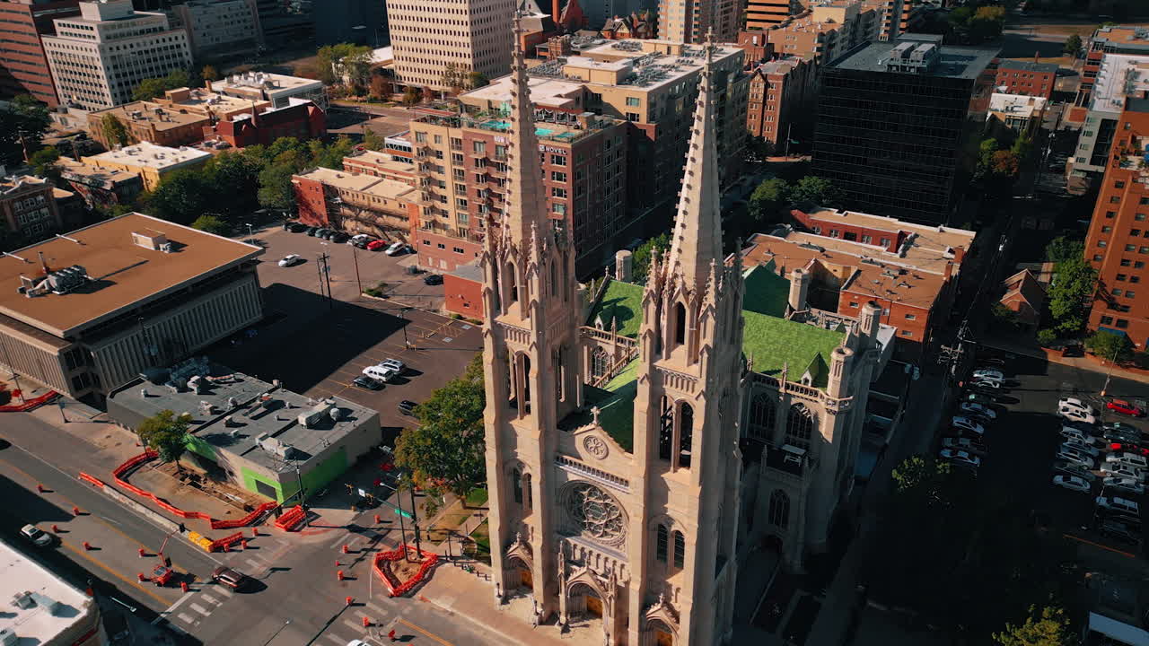 Denver, USA, 28 July 2025: Beautiful architecture of the Cathedral Basilica of Denver, Colorado, USA. Drone flight at the front façade of the building on sunny day