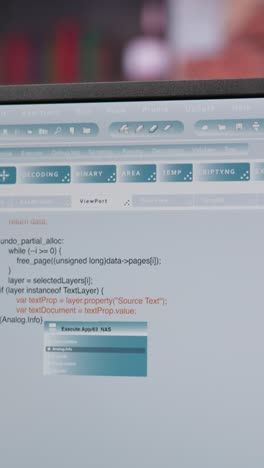 Vertical video Close up of person using coding application to write and test code