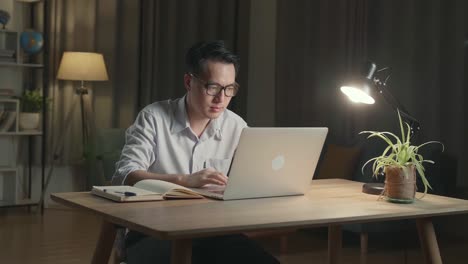 Man Working Late at Home on Laptop