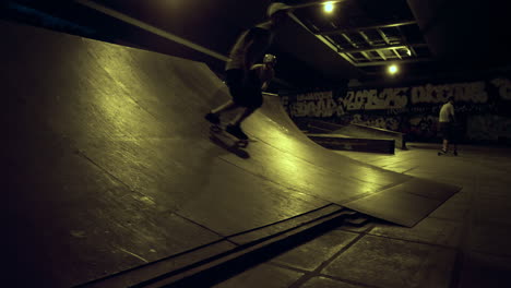 teenage riders preparing competition together at evening skatepark.