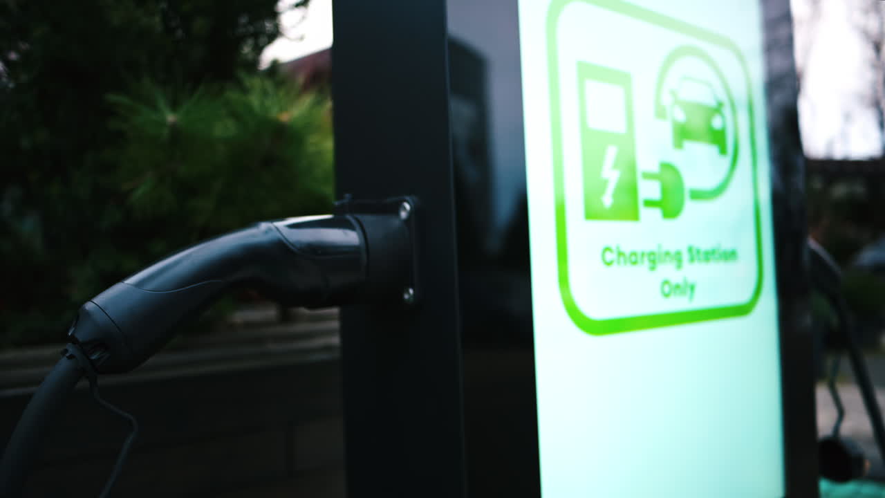 Futuristic black outdoor charging station for electric vehicles