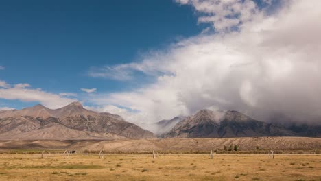 Time-Lapse-Clouds-Travel-Over-Plains-And-Mountains