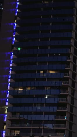 nighttime view of a lit-up building facade