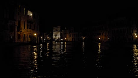 corner of venice buildings by the grand canal at night with beautiful latern reflections