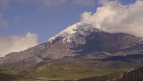 chimborazo stratovolcano mountain in ecuador with snow capped peak and cloudy horizon