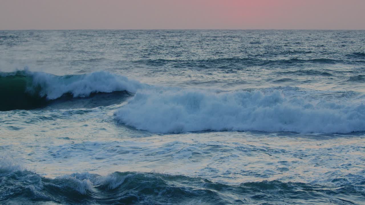 Beautiful Red sky over the Indian ocean, Durban Kwazulu-Natal South Africa. Summer sunset seascape with breaking waves.