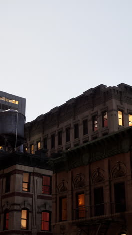 a view of old buildings in new york city at night