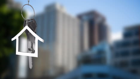 animation of silver house key and jey fob over cityscape