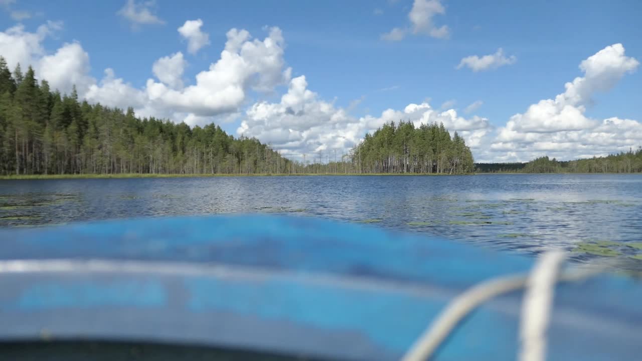 Rowing boat on lake bow view, small boat on lake, Finland