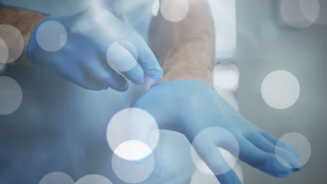 animación de puntos de luz sobre un médico caucásico con guantes médicos
