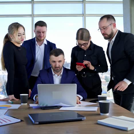 corporate presentation for businesspeople in office. motivated team leader explaining company development strategy