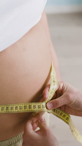 measuring a pregnant woman's belly
