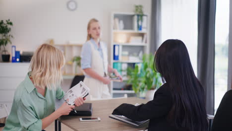 Three-Women-Start-Business-Meeting-at-Conference-Table