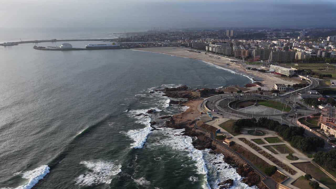 Aerial View of Coastal City with Beach and Port