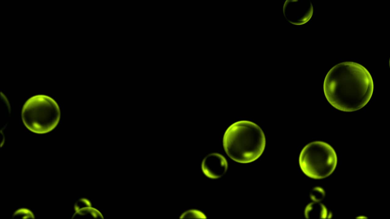 Yellow or golden bubbles float and drift upwards on a black background. A seamless loop perfect for celebration, luxury, or abstract motion graphics