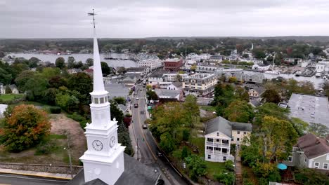 aerial over fall leaves and church in mystic connecticut