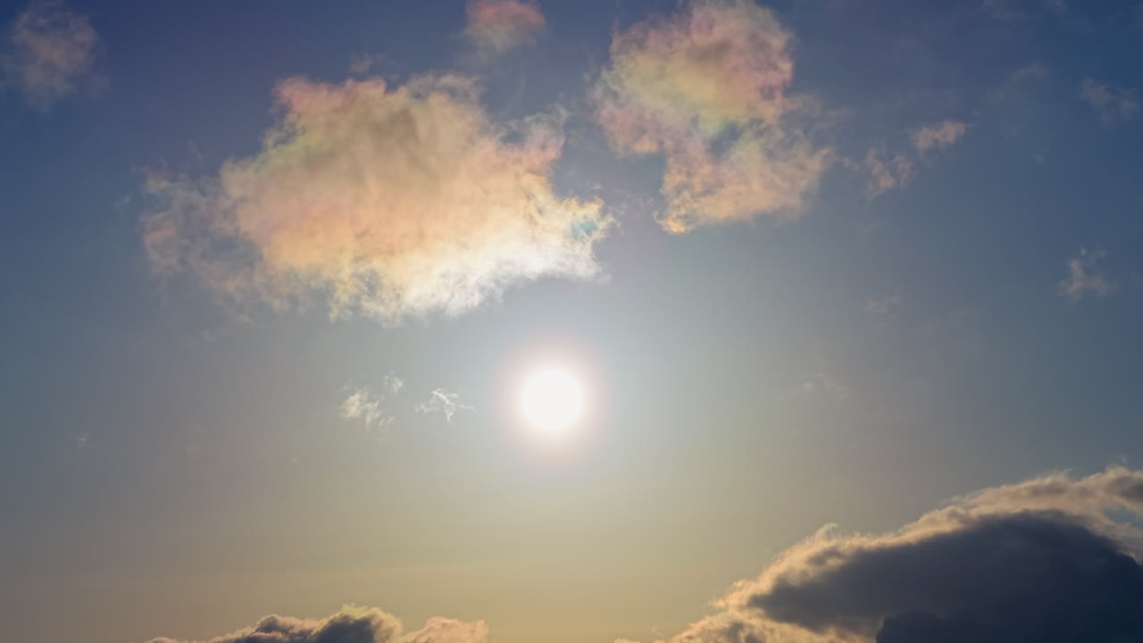 Aerial drone view of the sun peaking through the clouds