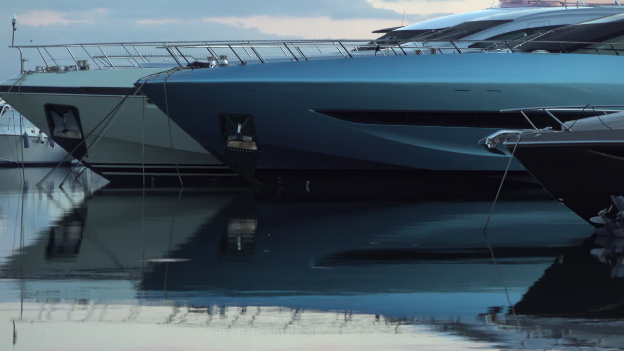 Antibes, France - March 21, 2025: Multiple boats docked in the port in the evening