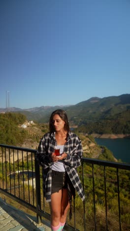 woman enjoying tea with a view