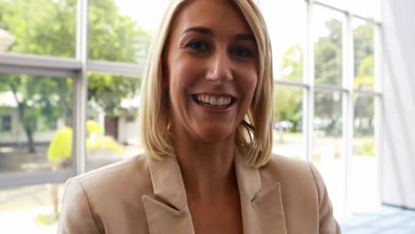 businesswoman standing with arms crossed in office 4k