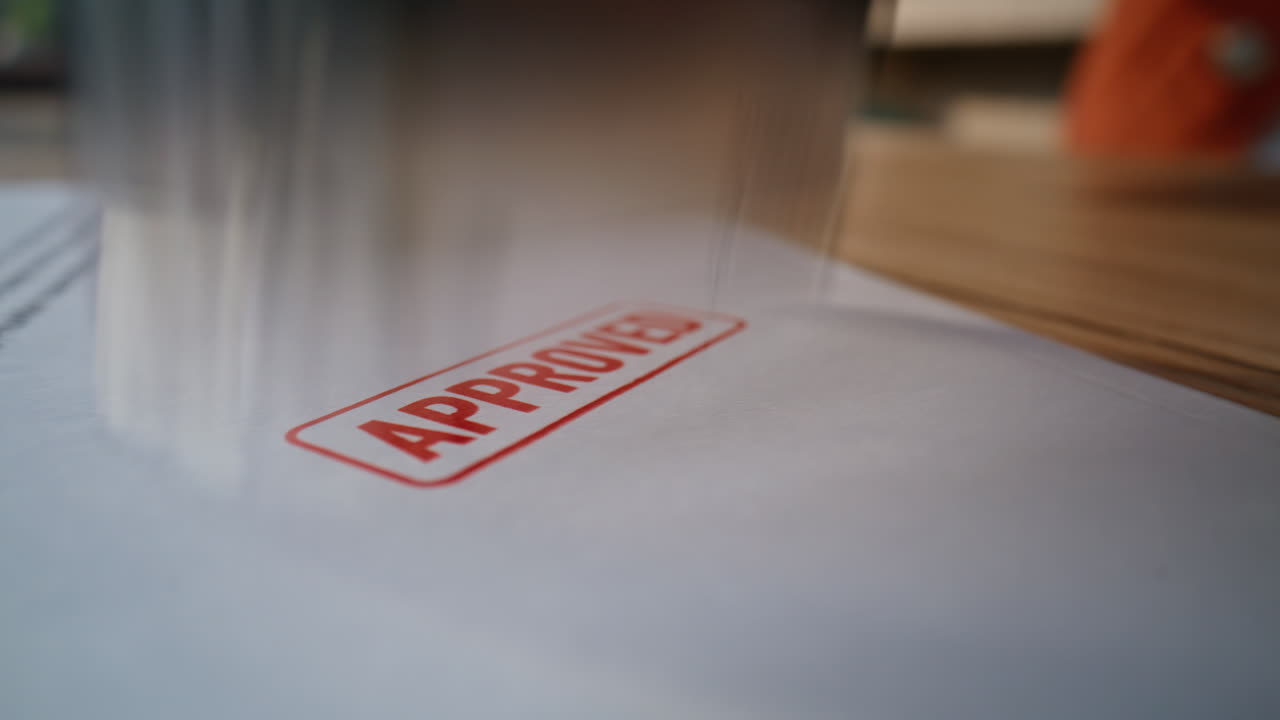 Closeup legal document stamped by unknown lawyer hand in professional office