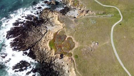 Cliffside-meeting-ocean-from-high-altitude