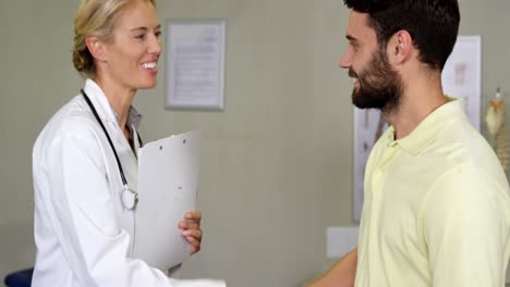 physiotherapist shaking hands with patient