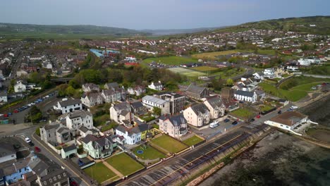 Aerial-shot-of-Whitehead,-a-seaside-village-in-Co