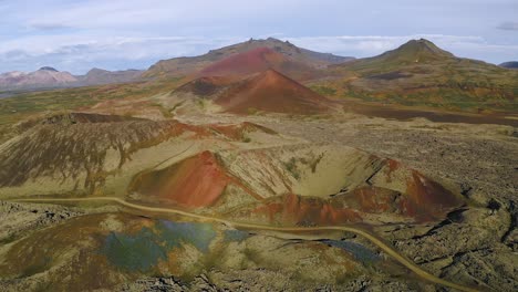 aerial backwards showing red volcanic craters in snaefellsnes iceland