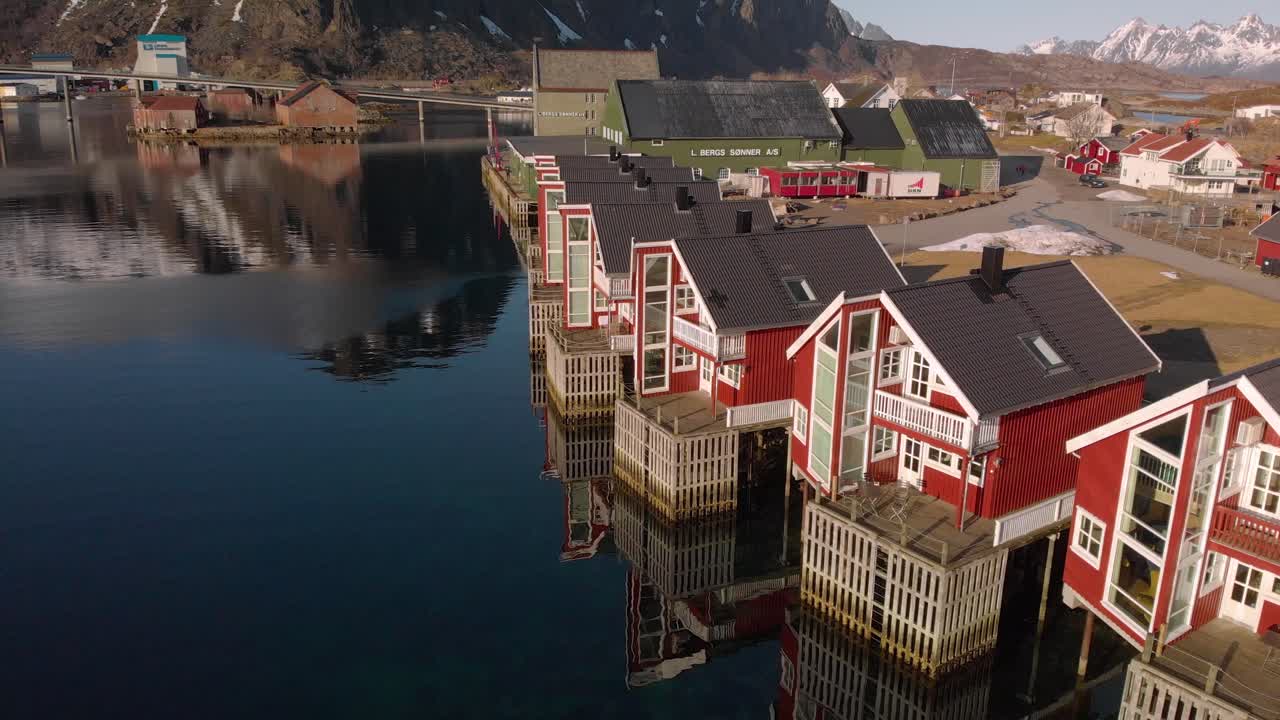 Aerial drone shot of red houses in Lofoten, Norway. Close to the sea