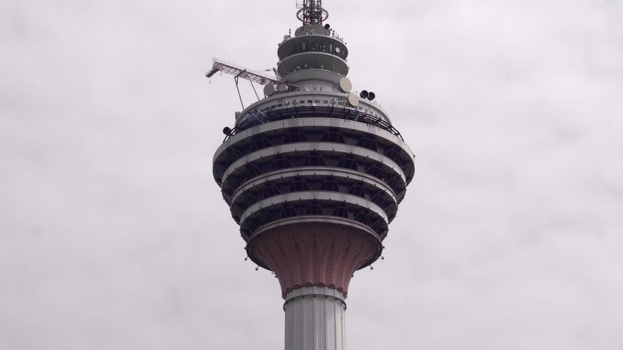 Base jumpers jumping from Menara tower in Kuala Lumpur.