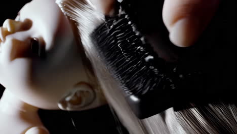 styling doll hair with a comb