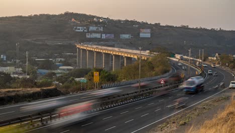 time lapse of busy high speed vehicle traffic on mumbai - pune - bengaluru s shaped national highway