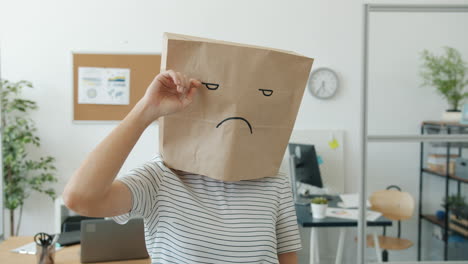 Woman with Paper Bag on Head in Office