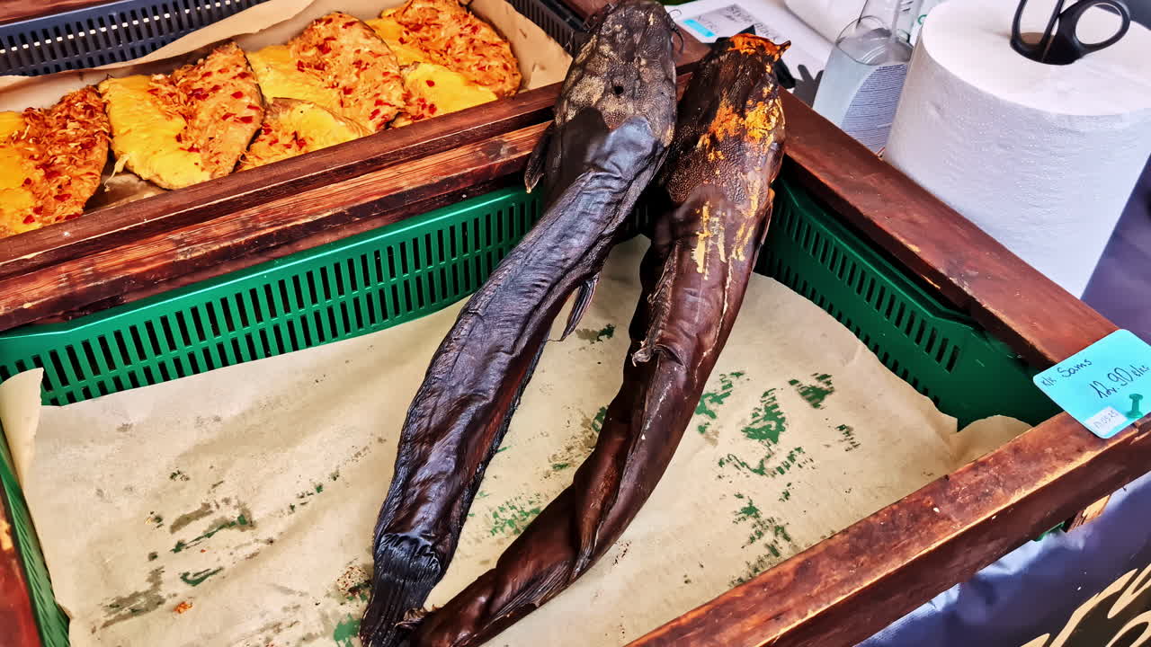 Delicious smoked fish for sale in Indonesia market, motion view