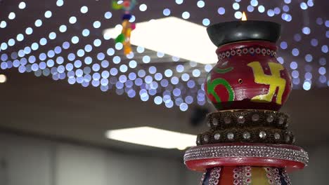 turning hindu lamp with om and swastika symbols during havan ceremony 2