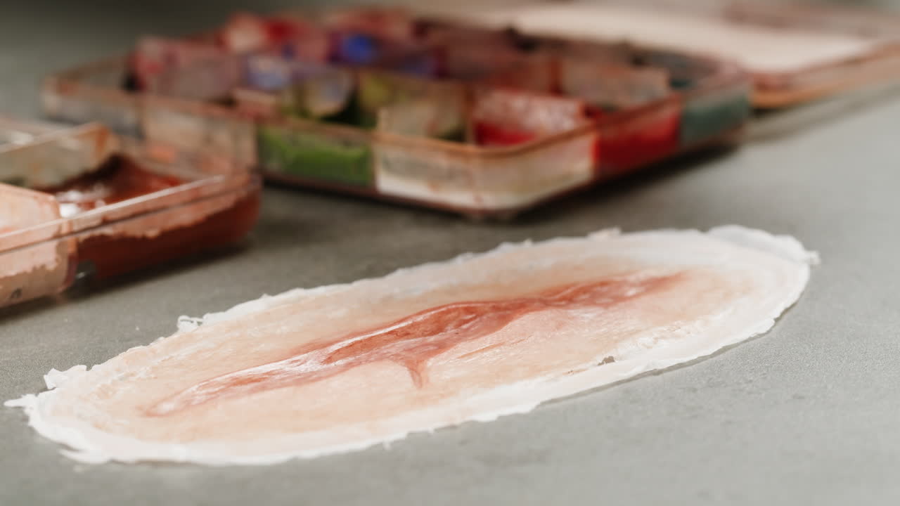 A rubber fake finger with blood close-up. Make-up equipment props for films and shooting. Bloody fake fingers for halloween and parties