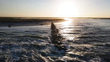 Orbit-shot-of-New-Smyrna-Beach-jetty-during-sunset