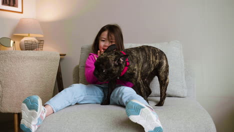 girl playing with dog