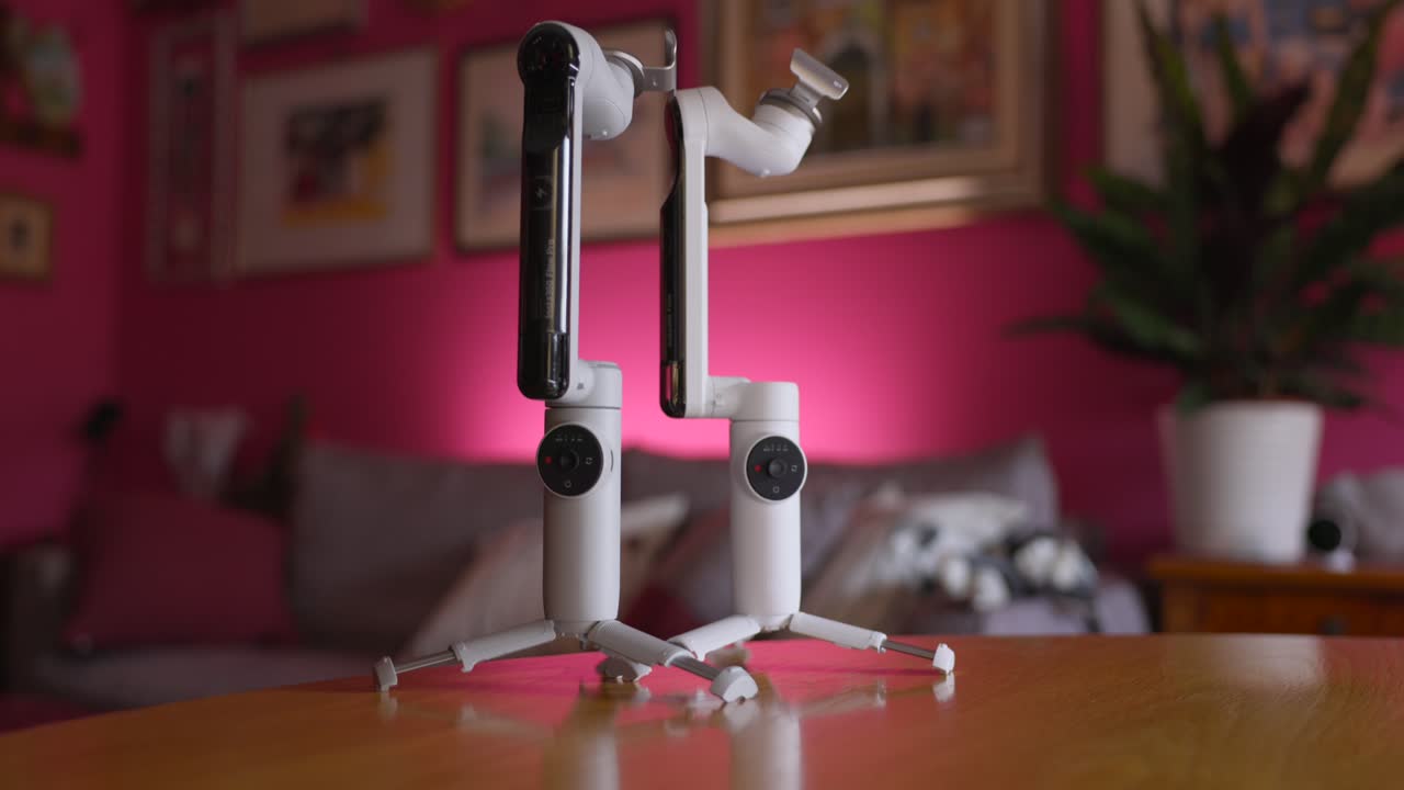Two Insta360 Flow Gimbals On The Table - Tilt Up Shot