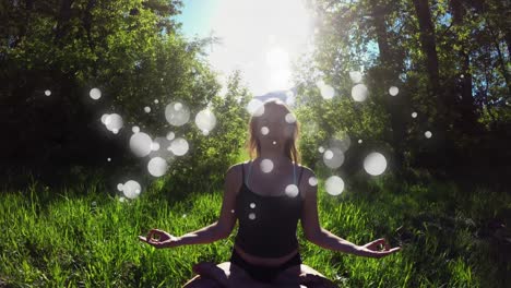 woman practicing yoga in forest