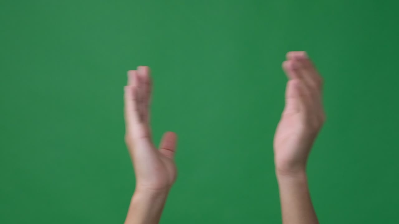 Clapping hands over green screen