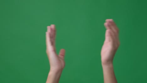 clapping hands over green screen