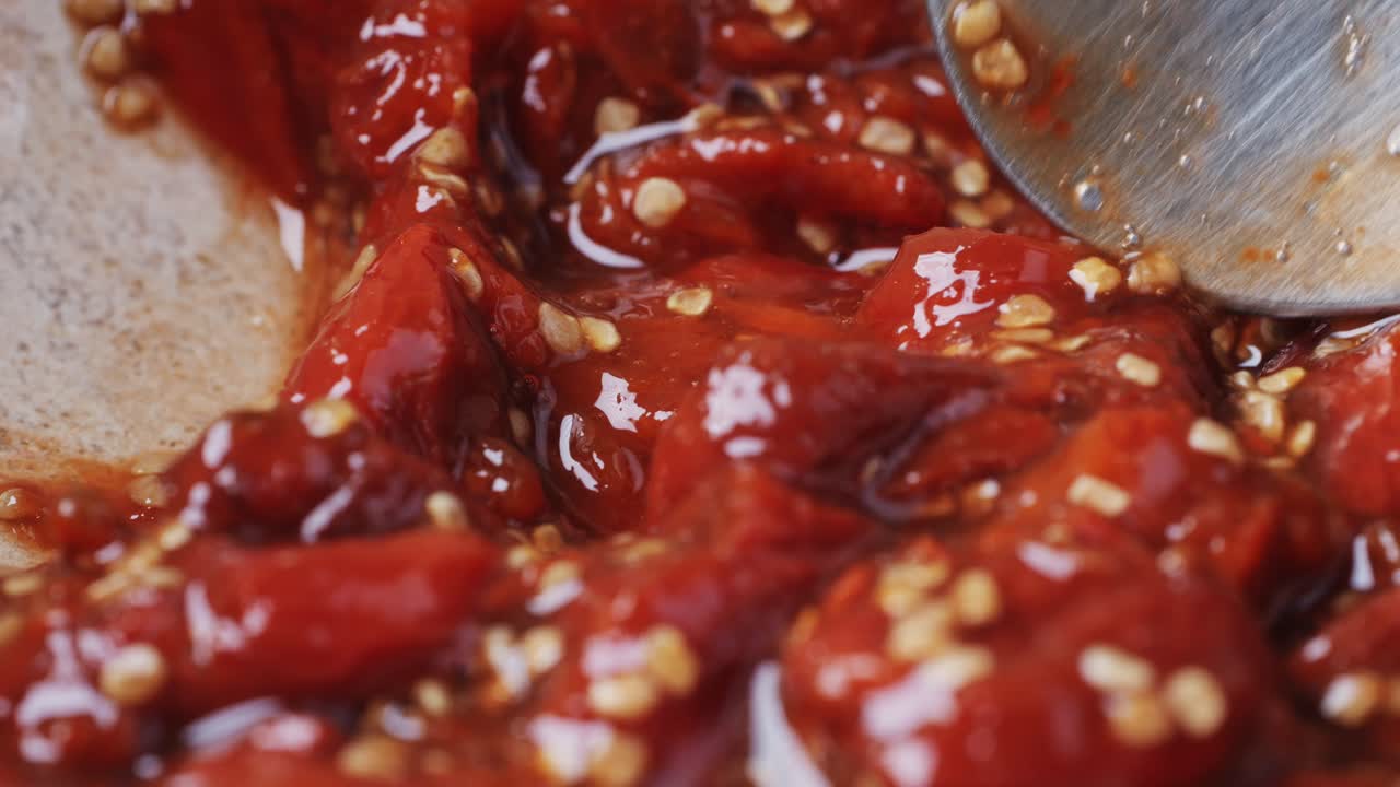 Close-up of Red Pepper Mixture with Spoon