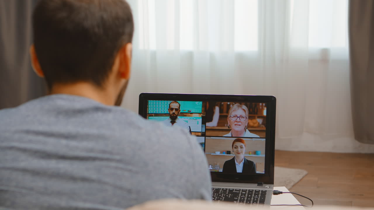 Back view of freelancer in a conference call