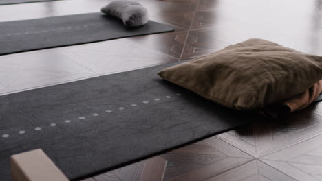 yoga studio with mats, pillows, and blocks
