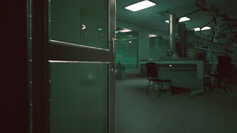 a dark, empty laboratory with a microscope