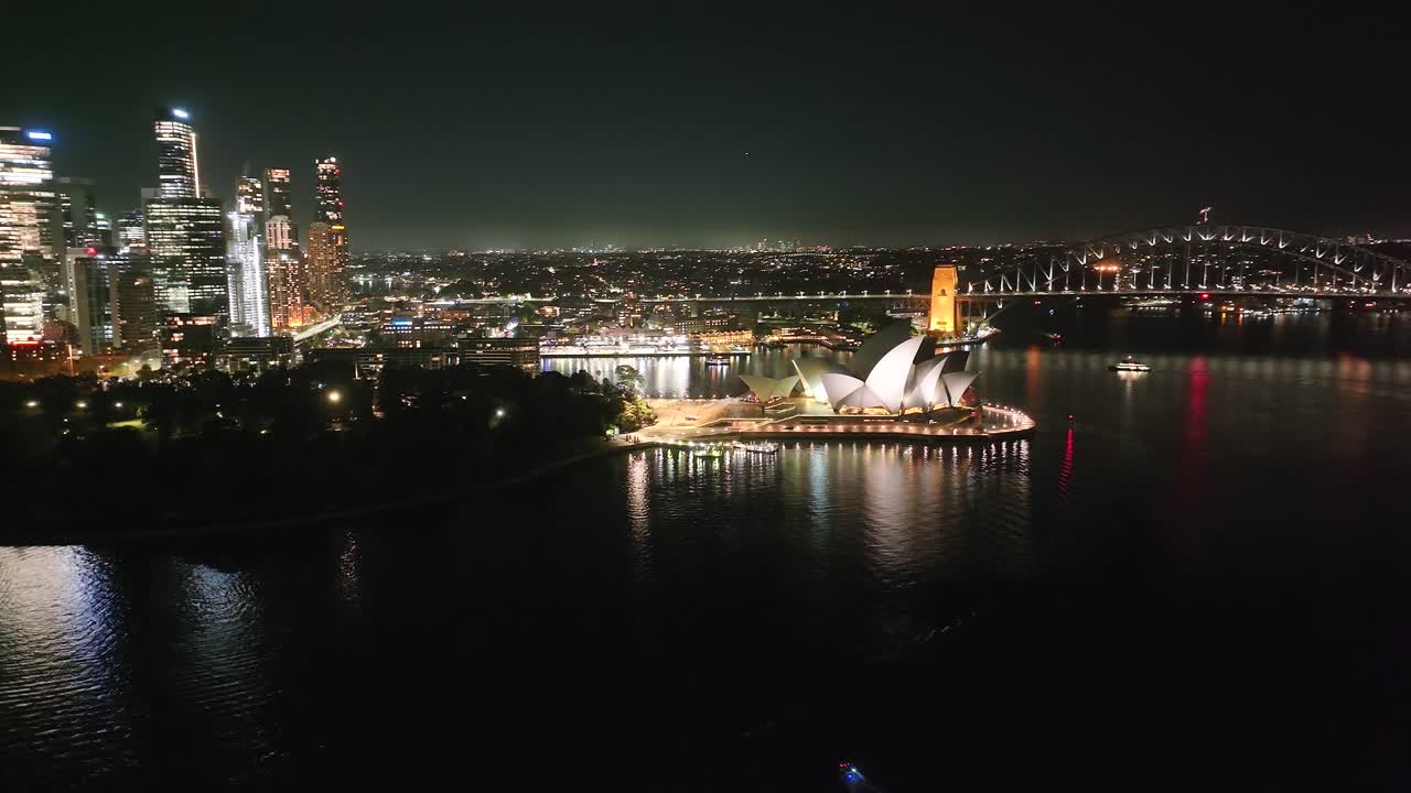 Night life in Sydney city, Australia. Drone cityscape with iconic landmarks and buildings.