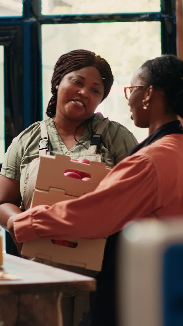 Vertical Video Market employee receiving products from farmers daughter